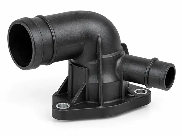 Molded automotive coolant connector and thermal management valve housing