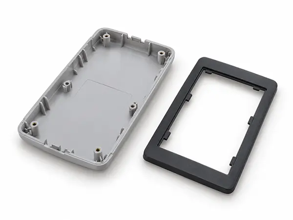 Injection molded electronic device cover and display bezel