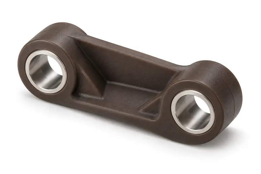 High-temperature plastic linkage bracket with stainless steel bushing inserts