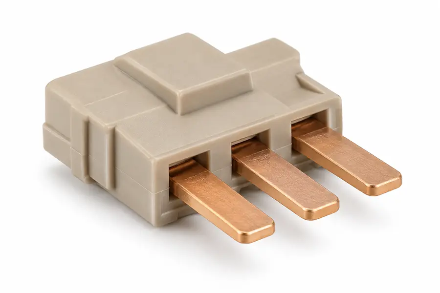 High-temperature plastic connector body molded around three copper terminals