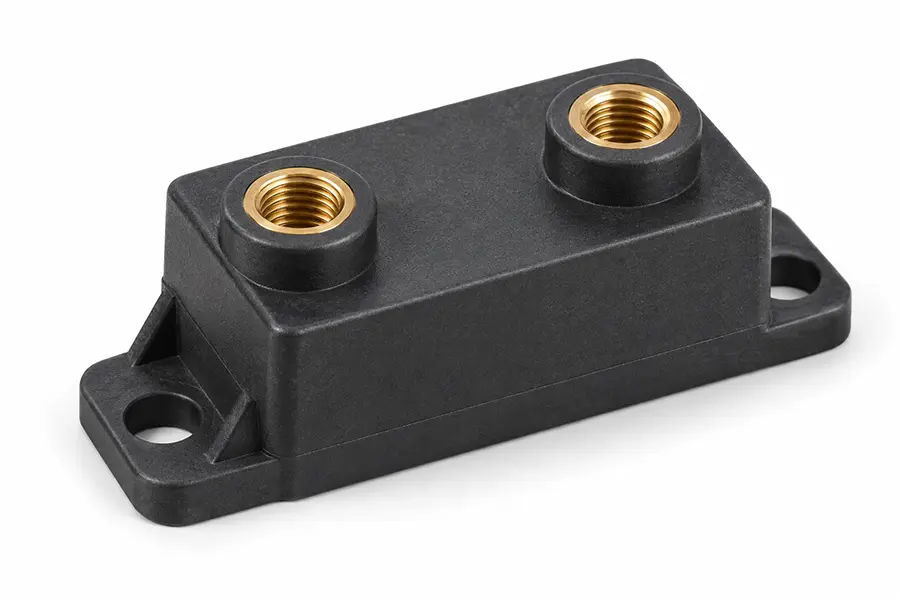 High-temperature plastic mounting component with brass threaded inserts