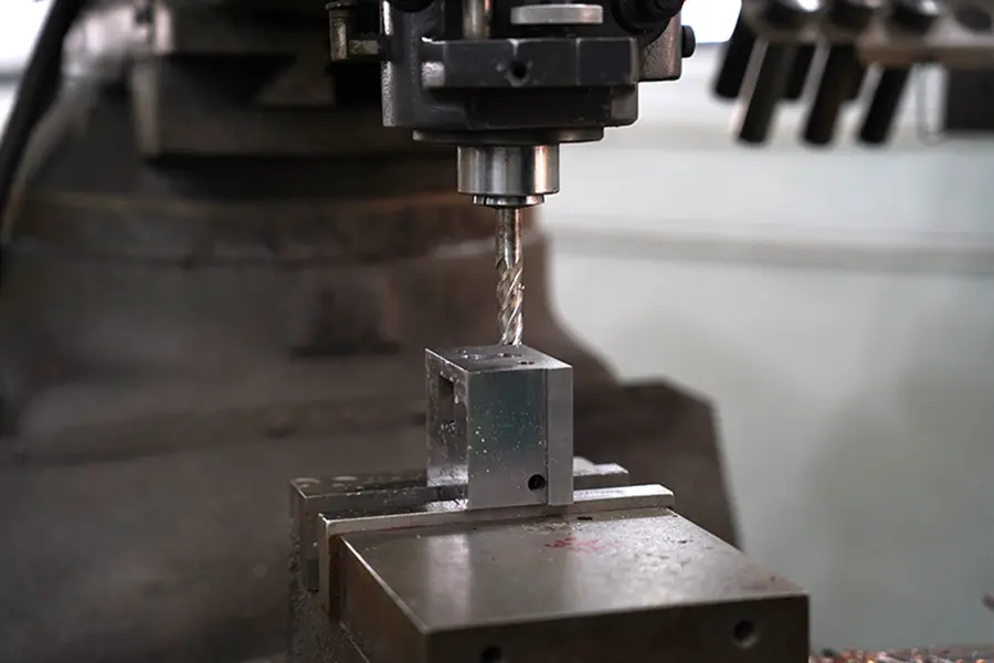 Deep hole drilling of a mold plate