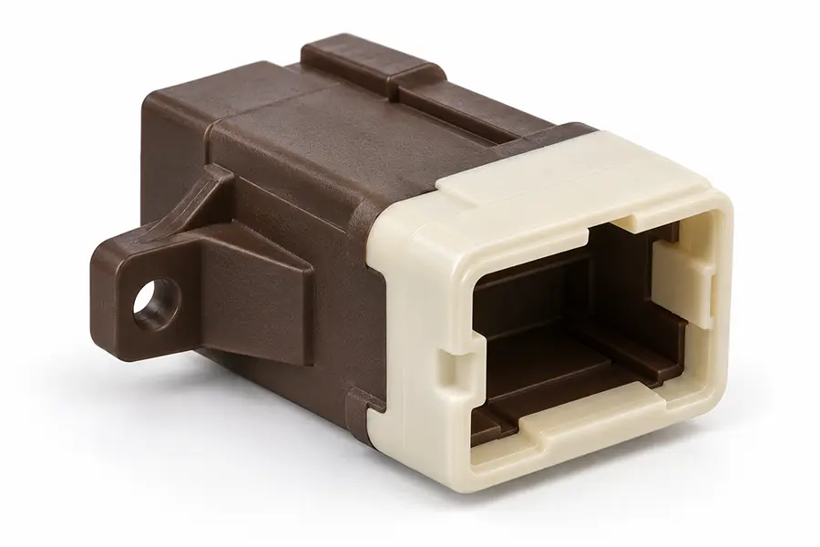 Two-material plastic connector housing illustrating plastic-on-plastic overmolding