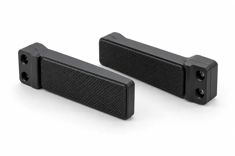 Pair of robotic gripper finger pads with textured gripping faces