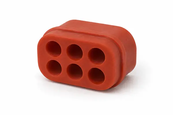 Six-hole red silicone seal for an automotive electrical connector